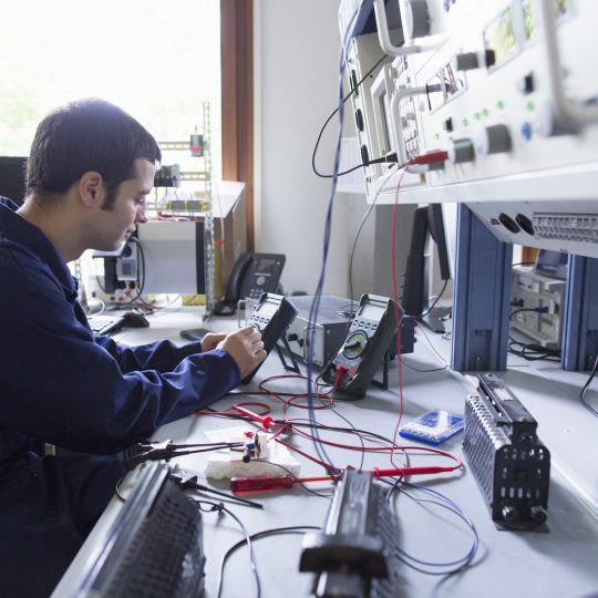 male-electrician-repairing-electronic-equipment-in-2022-03-08-00-13-59-utc (1)-min
